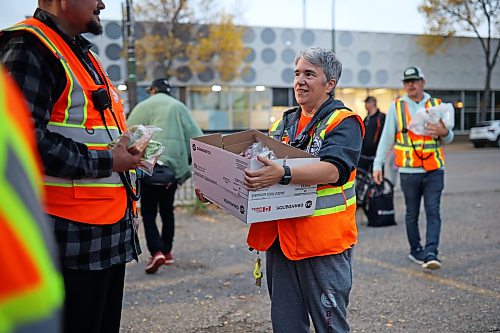 25092026
Cyndi Price, a member of the Brandon Bear Clan Women’s Council, hands out wraps, vegetables and sandwiches to anyone needing a meal along with other Bear Clan members outside the Brandon Friendship Centre on Princess Avenue on Friday evening at the beginning of the Bear Clan’s patrol of downtown Brandon. 
(Tim Smith/The Brandon Sun)