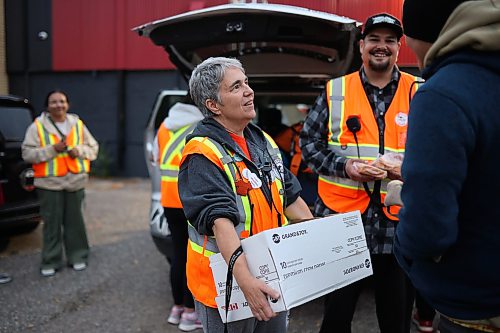 25092026
Cyndi Price, a member of the Brandon Bear Clan Women’s Council, hands out wraps, vegetables and sandwiches to anyone needing a meal along with other Bear Clan members outside the Brandon Friendship Centre on Princess Avenue on Friday evening at the beginning of the Bear Clan’s patrol of downtown Brandon.
(Tim Smith/The Brandon Sun)