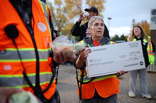 25092026
Cyndi Price, a member of the Brandon Bear Clan Women’s Council, hands out wraps, vegetables and sandwiches to anyone needing a meal along with other Bear Clan members outside the Brandon Friendship Centre on Princess Avenue on Friday evening at the beginning of the Bear Clan’s patrol of downtown Brandon.
(Tim Smith/The Brandon Sun)