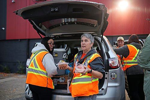 25092026
Cyndi Price, a member of the Brandon Bear Clan Women’s Council, hands out wraps, vegetables and sandwiches to anyone needing a meal along with other Bear Clan members outside the Brandon Friendship Centre on Princess Avenue on Friday evening at the beginning of the Bear Clan’s patrol of downtown Brandon. 
(Tim Smith/The Brandon Sun)
