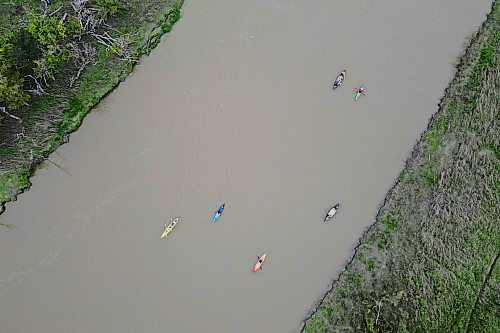 26092026
Kayakers and canoeists paddle up the Assiniboine River west of 18th Street North in Brandon during a sunset cruise group paddle as part of Paddlefest 2026 at the Riverbank Discovery Centre on Saturday.
(Tim Smith/The Brandon Sun)