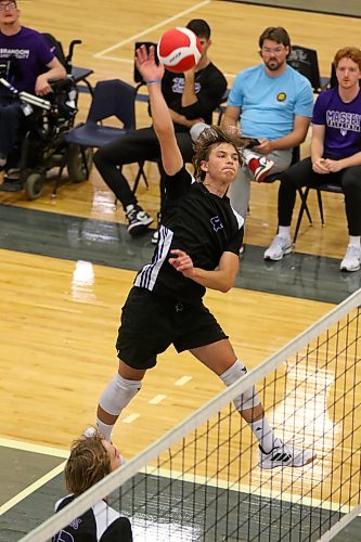Grade 11 outside hitter Jagger Hansen-Young attacks during the BU tourney final. (Thomas Friesen/The Brandon Sun)