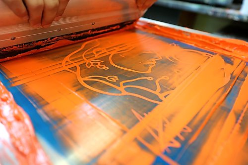 Ruth Bonneville / Free Press
LOCAL - TRC shirts
Elmwood High School students Daniel Concepcion in Grade 12 (glasses) and Lexington Zastre in grade 10 of the shops program, work together screen printing TRC shirts during their class at Elmwood High School (headquarters/shops for Elmwood Supply Co.) on Monday.
Story: TRC SCHOOLS: A high school student-run biz, Elmwood Supply Co is printing 800+ TRC designs on black t-shirts with logos of an Elmwood High alum's design for Orange Shirt Day. The group secured a grant from WSD to distribute shirts to every single student.
See story by Maggie
Sept 28th, 2026