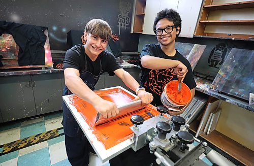 Ruth Bonneville / Free Press
LOCAL - TRC shirts
Elmwood High School students Daniel Concepcion in Grade 12 (glasses) and Lexington Zastre in grade 10 of the shops program, work together screen printing TRC shirts during their class at Elmwood High School (headquarters/shops for Elmwood Supply Co.) on Monday.
Story: TRC SCHOOLS: A high school student-run biz, Elmwood Supply Co is printing 800+ TRC designs on black t-shirts with logos of an Elmwood High alum's design for Orange Shirt Day. The group secured a grant from WSD to distribute shirts to every single student.
See story by Maggie
Sept 28th, 2026