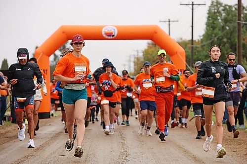 Runners begin their half-marathon run from just south of the Birtle Residential School site on Saturday. (Tim Smith/The Brandon Sun)