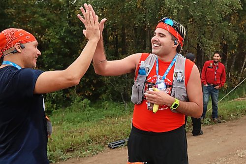 28092026
Luther Alexander of Pine Creek First Nation and Winnipeg high-fives Dylan Peyachew of Winnipeg after both finsihed the fifth annual Reconciliation Run half marathon from the former Birtle Residential School site to Birdtail Sioux First Nation on Saturday.
(Tim Smith/The Brandon Sun)