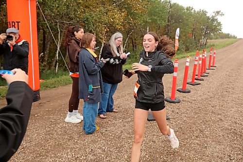 Leah van den Heuvel of Birtle crosses the finish line while taking part in Saturday's run. (Tim Smith/The Brandon Sun)