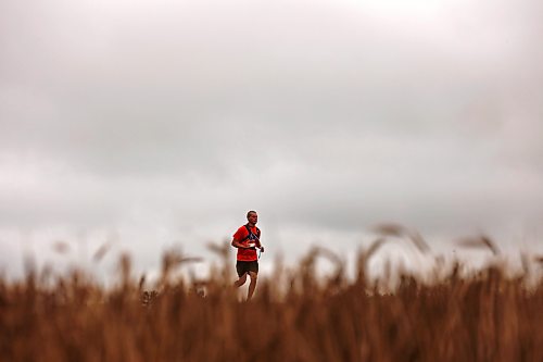 28092026
A runner passes by a field of wheat while taking part in the fifth annual Reconciliation Run half marathon from the former Birtle Residential School site to Birdtail Sioux First Nation on Saturday. 
(Tim Smith/The Brandon Sun)
