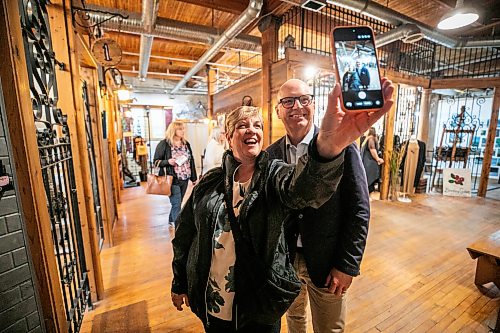 MIKAELA MACKENZIE / FREE PRESS
	
Scott Gillingham takes a selfie with minister Lisa Naylor at ARTlington on Saturday, Sept. 26, 2026.

For Malak day-in-the-life story.
Free Press 2026
