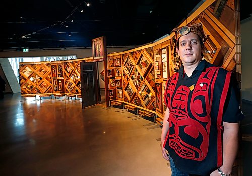 Artist Carey Newman of Vancouver Island with his art installation called The Witness Blanket at the opening Monday in the Canadian Museum For Human Rights.The exhibit was created from hundreds of items reclaimed from residential schools, churches, government buildings, and other structures all across Canada. Intern story Wayne Glowacki / Winnipeg Free Press Dec. 14 2015