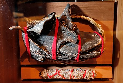 Harold Gatensby, a survivor of the Carcross Residential School in the Yukon found this child's shoe at the site of the original school that burned down in the early 1900's. This is part of Artist Carey Newman of Vancouver Island art installation called The Witness Blanket in the Canadian Museum For Human Rights.The exhibit was created from hundreds of items reclaimed from residential schools, churches, government buildings, and other structures all across Canada. Intern story Wayne Glowacki / Winnipeg Free Press Dec. 14 2015
