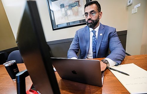 Obby Khan, former leader of the Manitoba PC party, works in his office in the legislature in Winnipeg on Tuesday. (John Woods/Winnipeg Free Press)