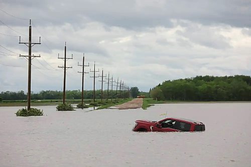 Swathes of farm land were submerged and municipal roads and provincial highways were washed out by overland flooding from western Manitoba to the Interlake after severe flooding hit several communities in June and July. (Tim Smith/The Brandon Sun files)