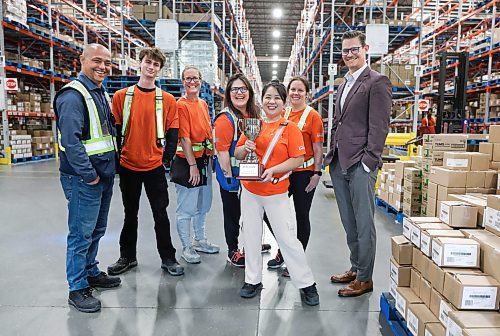 Ruth Bonneville / Free Press

Biz  McKesson Canada

Story on  McKesson Canada Winnipeg Distribution Centre. a 120,000 to 125,000-square-foot pharmaceutical facility located and distribution centre located in the northwest part of Winnipeg.

Group photo of McKesson staff and leaders with their trophy in their large distribution warehouse Tuesday. 

Names from left:  Robert West, Liam Pickering, LaraBee Henderson, Kristina Redmond, Cathleen Isagunde, Nicole Busch and Tim Smith Senior Vice President Marketing. 

Story runs on  Oct. 5 'Made in Manitoba' feature 

Story by Aaron

Sept 29th,  2026