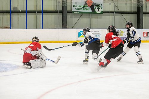 BROOK JONES/FREE PRESS
The Manitoba Women's High School Hockey League hosts the women's high school playoffs at the Seven Oaks Arena in Winnipeg, Man., Friday, March 11, 2025. The CJS Olympiens  earned a 2-0 victory over the the Glenlawn Lions in Game 3 to win the best-of-three final series 2-1 and earn the MWHSHL league championship and the Wayne Thompson Cup. Pictured: Olympiens forward Payton Durand (No. 25) lets a shot go as she scores the first goal of the game during first period action.