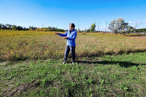 Ruth Bonneville / Free Press
LOCAL - Rotary Tall Grass Nature Park
Patricia Dutchak, a member of the Rotary Club, looks out from the Rotary Tall Grass Nature Park at the adjacent commercial development. The park's native tall grass prairie faces ongoing environmental damage due to the misuse of land during the surrounding commercial construction.
Rotary Tall Grass Nature Park, a long strip of treed pathways and tall grass between commercial properties near 1001 Regent Ave W.
Story: Patricia Dutchak is a member of the Rotary Club of Winnipeg-Transcona. She’s been documenting the significant damage to the Rotary Tall Grass Nature Park in Transcona caused during the relocation of a fence between the park and the Amazon fulfillment centre next door. Large swaths of grass and foliage in the protected nature preserve were trampled by heavy equipment in August. The city is apparently seeking damages.
Eva Wasney
Oct 1st, 2026