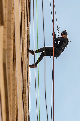 MIKE DEAL / FREE PRESS
Morgan Shipley, dressed as Cat Woman rappels down the side of the HSC Children’s Hospital during the fifth anniversary of the Suspended Superheroes event Friday afternoon.
Reporter: Kelly-Anne Riess
261002 - Friday, October 02, 2026.