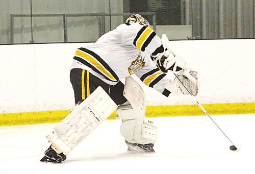 Cooper Dryden plays the puck against the Kenora Thistles. He says playing the puck when the opportunity arises is part of his game (Rowan McCarthy/The Brandon Sun).