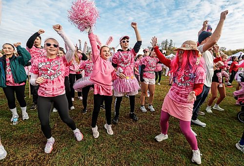 JOHN WOODS / FREE PRESS
Monica Gerrie, right, and other people warm up prior to participating in the annual Canadian Cancer Society Run For The Cure at Assiniboine Park in Winnipeg, Sunday, October 4, 2026. 

reporter: maggie