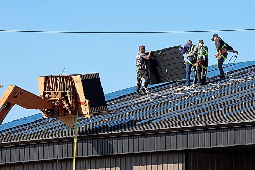 Workers install solar panels on the roof of the under-construction Wheat City Tennis and Pickleball Hub on Pacific Avenue in downtown Brandon on a sunny Tuesday.
(Tim Smith/The Brandon Sun)
