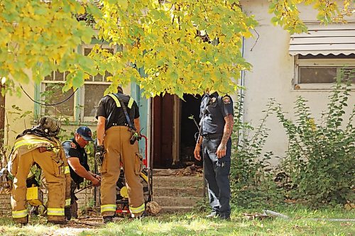Brandon Fire and Emergency Services members pack up equipment at a home on Percy Street in Brandon’s east end after responding to a fire at the home on Tuesday. According to neighbours a lone male occupant of the home was taken to hospital in unknown condition.
(Tim Smith/The Brandon Sun)