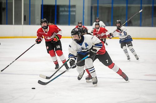 BROOK JONES/FREE PRESS
The Manitoba Women's High School Hockey League hosts the women's high school playoffs at the Seven Oaks Arena in Winnipeg, Man., Friday, March 11, 2025. The CJS Olympiens  earned a 2-0 victory over the the Glenlawn Lions in Game 3 to win the best-of-three final series 2-1 and earn the MWHSHL league championship and the Wayne Thompson Cup. Pictured: Olympiens forward Payton Durand (No. 25) skates down the ice with the puck en route to scoring the first goal of the game during first period action.