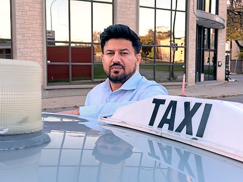 MORGAN MODJESKI / FREE PRESS
Abhishek Tara, Unicity Taxi’s general manager, stands near one of the 305 Unicity Taxis rolling in Winnipeg on Wednesday, Oct. 7, 2026. He’s calling for people to come forward with information after one of his drivers was sent to hospital following an attack by a man with a hammer on Oct. 3, 2026.