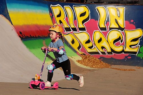Ophelia Saville scooters in the sun at the Kristopher Campbell Memorial Skate Plaza in Brandon on a warm Wednesday afternoon. (Tim Smith/The Brandon Sun)