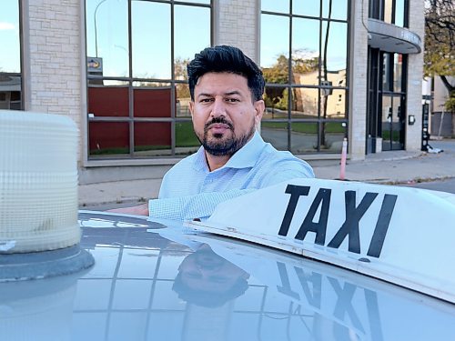 MORGAN MODJESKI / FREE PRESS
Abhishek Tara, Unicity Taxi’s general manager, stands near one of the 305 Unicity Taxis rolling in Winnipeg on Wednesday, Oct. 7, 2026. He’s calling for people to come forward with information after one of his drivers was sent to hospital following an attack by a man with a hammer on Oct. 3, 2026.