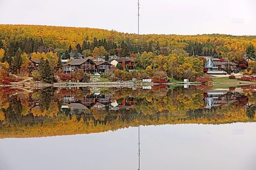 Vibrant all colours are reflected in Minnedosa Lake on a calm Thursday morning. 
(Tim Smith/The Brandon Sun)