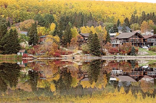 Vibrant all colours are reflected in Minnedosa Lake on a calm Thursday morning. 
(Tim Smith/The Brandon Sun)