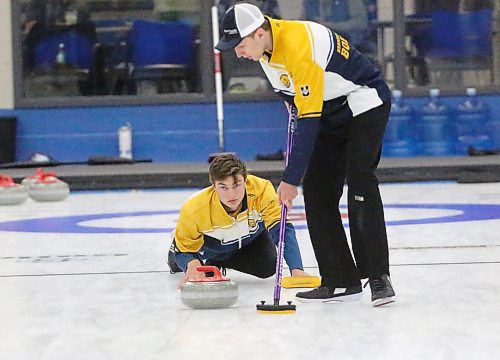 Tristan Purkess aims his shot while Colton Graham positions himself to sweep. Purkess is filling in for regular lead Jonathan Craig Penner, who cannot make it to Superleague matches due to school commitments. (Rowan MCCarthy/The Brandon Sun)