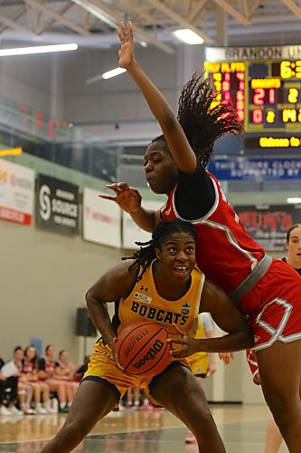 Josephine Odude draws her defender into the air as the Brandon University Bobcats play the Algoma Thunderbirds in university women's basketball pre-season action at the Healthy Living Centre on Friday. (Thomas Friesen/The Brandon Sun)