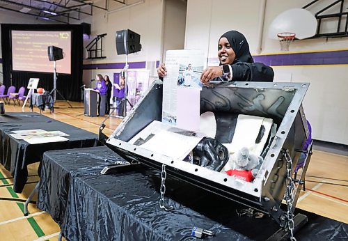 Ruth Bonneville / Free Press

Standup Time Capsule 

Gordon Bell, grade 12 student, Rayan Abdulle  places  Free Press newspaper article by Maggie Macintosh into the new time capsule at the centennial celebration event Friday. 

SCHOOL TIME CAPSULE: Gordon Bell High School unearthed the contents of a 1960 school time capsule and put  together one for 2026 on Friday as part of its centennial celebrations. The inner-city institution is marking 100 years since students have attended a school named after a provincial bacteriologist who was one of six of the first professors to ever be hired at the University of Manitoba. 

Oct 9th, 2026