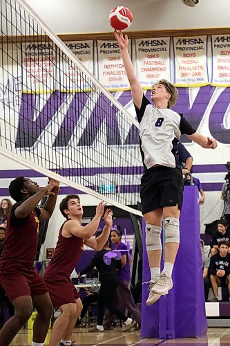 Samuel Redekop #8 of the Vincent Massey Vikings tips the ball as the Vikings play the Dr. Martin LeBoldus High School Golden Suns during the Viking Classic High School Varsity Volleyball Tournament at VMHS on Friday. 
(Tim Smith/The Brandon Sun)
