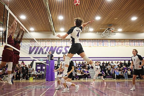 Jagger Hansen-Young #4 of the Vincent Massey Vikings leaps to hammer the ball as the Vikings play the Dr. Martin LeBoldus High School Golden Suns during the Viking Classic High School Varsity Volleyball Tournament at VMHS on Friday.
(Tim Smith/The Brandon Sun)