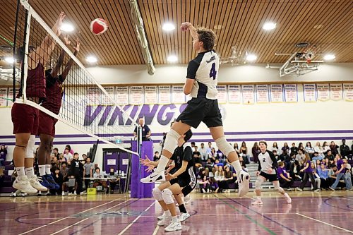 Jagger Hansen-Young #4 of the Vincent Massey Vikings leaps to hammer the ball as the Vikings play the Dr. Martin LeBoldus High School Golden Suns during the Viking Classic High School Varsity Volleyball Tournament at VMHS on Friday.
(Tim Smith/The Brandon Sun)