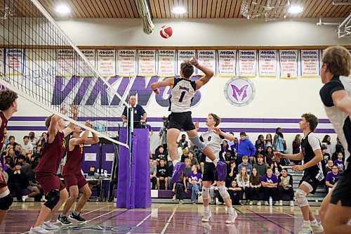 Charlie Gauthier #1 of the Vincent Massey Vikings leaps to hammer the ball as the Vikings play the Dr. Martin LeBoldus High School Golden Suns during the Viking Classic High School Varsity Volleyball Tournament at VMHS on Friday.
(Tim Smith/The Brandon Sun)