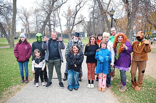 2026 Brandon Zombie Walk participants, dressed in zombie costumes, stand in Stanley Park before setting out on a roughly 3.5-kilometre walk through the city on Sunday afternoon. (Abiola Odutola/The Brandon Sun)