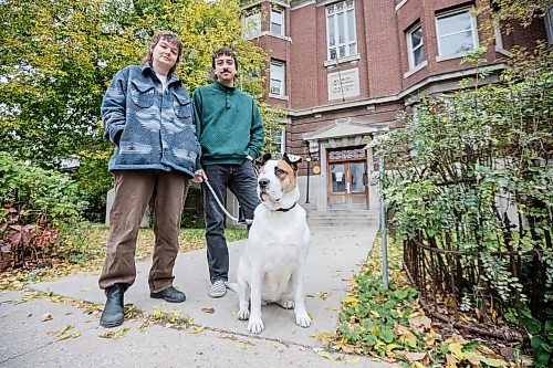 JOHN WOODS / FREE PRESS
Quincy Houdayer and partner Avery Helm, and their dog Honey are photographed outside their Furby St apartment in Winnipeg, Sunday, October 11, 2026. Residents in the block are allegedly experiencing problems with the building and landlord.

reporter: scott
