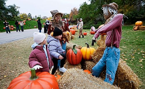 JOHN WOODS / FREE PRESS
Patch the Scarecrow has fun with Kalina, left, and Kasia and other people at Boo In The Zoo at the Assiboine Zoo in Winnipeg, Sunday, October 11, 2026.
reporter: standup