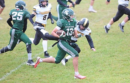 Yusef Eltawil breaks a tackle on his way to scoring a touchdown for Neelin. Eltawil ran in two four touchdowns for the Spartans and led the offence with 259 yards. (Rowan McCarthy/The Brandon Sun)