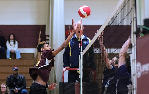Crocus Plainsmen Joseb Soares tips the ball over the net against the Vincent Massey Vikings during Brandon High School Volleyball League junior varsity boys' action at Crocus on Wednesday. (Thomas Friesen/The Brandon Sun)