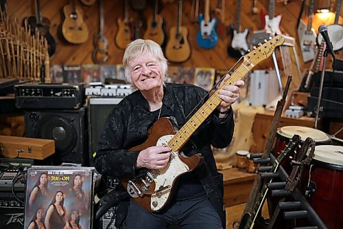 Bill Hillman with one of his many guitars in the basement of his home in Brandon on Wednesday, October 14, 2026. 
(Tim Smith/The Brandon Sun)