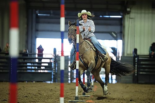 Kallie MacDonald competes in the high school pole bending event at the Brandon High School Indoor Rodeo at the Keystone Centre’s Assiniboine Credit Union Agricultural Centre on Thursday. The high school rodeo continues today. The Wheat City Cowtown Eastern Circuit Finals rodeo also kicked off Thursday evening and runs again tonight and tomorrow evening.
(Tim Smith/The Brandon Sun)