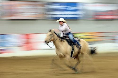 Ruby Oxtoby of Esterhazy, Sask., races across the finish line while competing in the high school barrel racing event. (Tim Smith/The Brandon Sun)