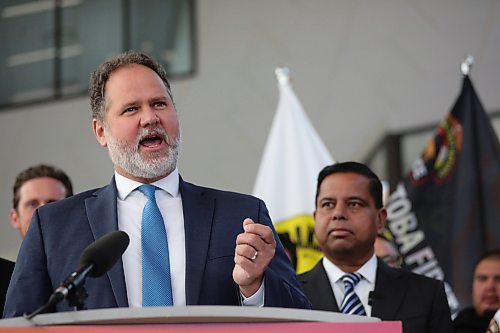 Federal Public Safety Minister Gary Anandasangaree watches Manitoba Justice Minister Matt Wiebe as he speaks during a press conference at the Waywayseecappo Convention Centre north of Brandon on Friday morning. (Matt Goerzen/The Brandon Sun)