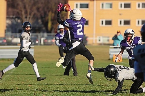 Aarron Rodin #2 of the Vincent Massey Vikings leaps to make an interception during high school football action against the Elmwood Giants at Vincent Massey High School on Friday afternoon.
(Tim Smith/The Brandon Sun)
