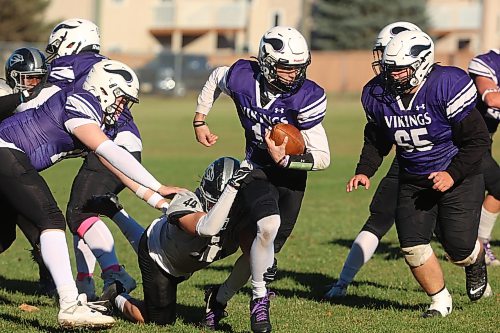 Quarterback Charlie Gauthier #11 of the Vincent Massey Vikings runs the ball during high school football action against the Elmwood Giants at Vincent Massey High School on Friday afternoon.
(Tim Smith/The Brandon Sun)