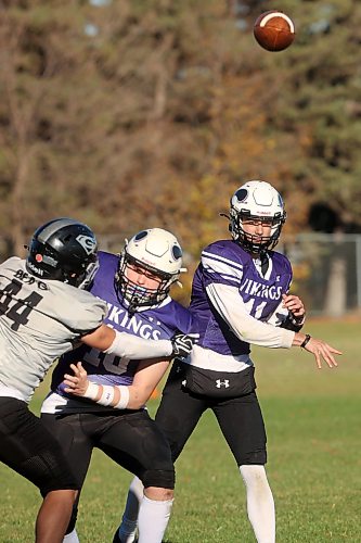 Quarterback Charlie Gauthier #11 of the Vincent Massey Vikings throws a pass during high school football action against the Elmwood Giants at Vincent Massey High School on Friday afternoon. 
(Tim Smith/The Brandon Sun)